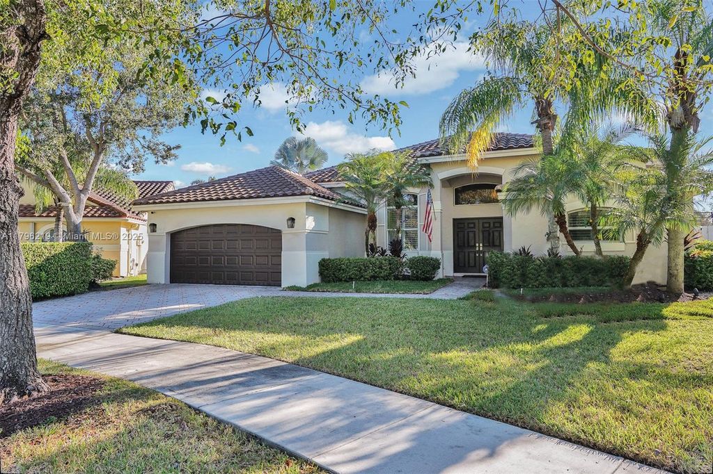 Photo of 648 Lake Blvd, Weston, FL 33326 (MLS # A11796219)