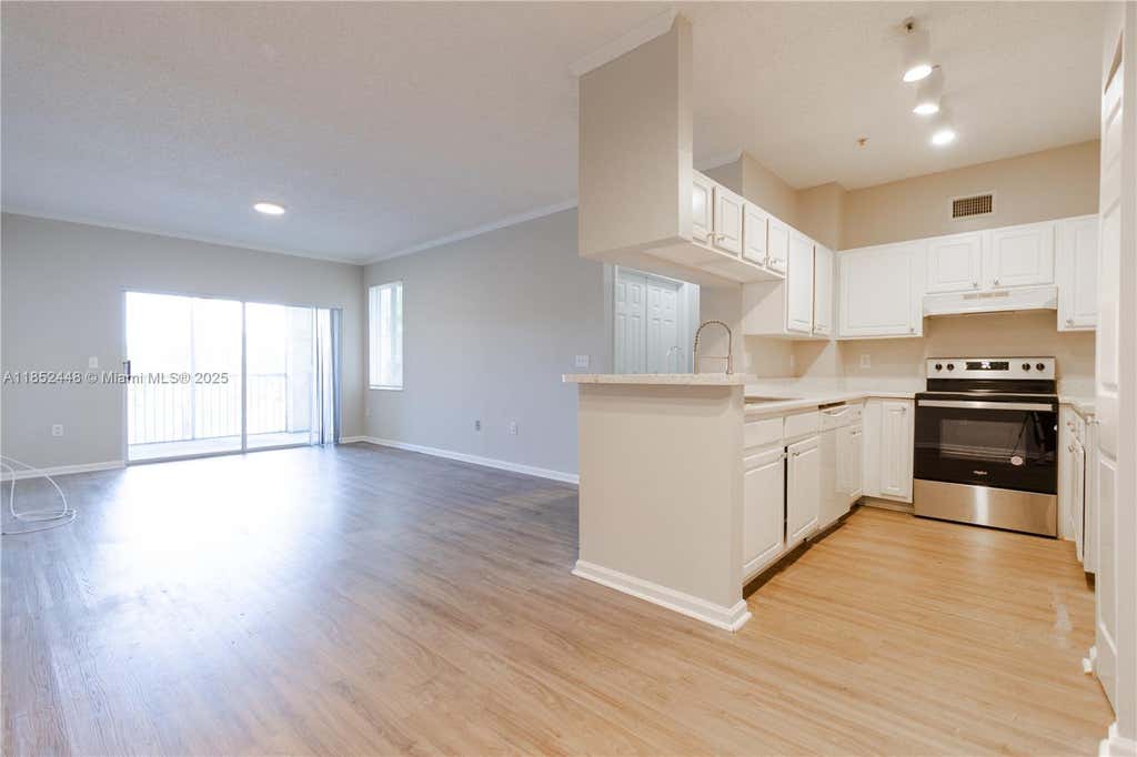 Photo of 11611 W Atlantic Blvd #1332, Coral Springs, FL 33071 (MLS # A11852448)