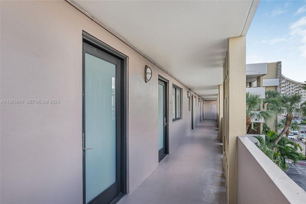 Photo of 301 Golden Isles Dr #403, Hallandale Beach, FL 33009 (MLS # A11966924)