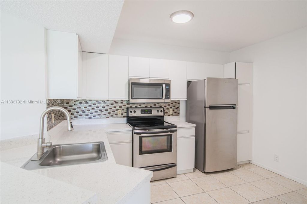 Photo of 9033 Wiles Rd #303, Coral Springs, FL 33067 (MLS # A11896792)