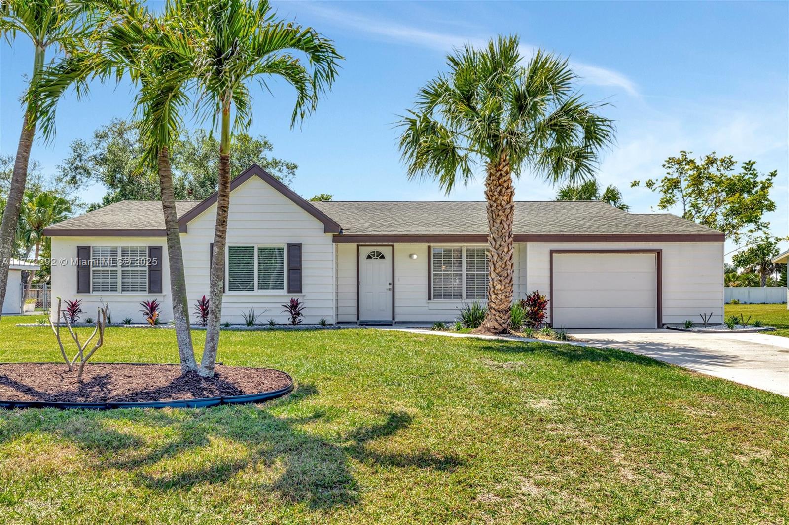 This beautifully updated home sits on an oversized lot of over .32 acres, offering a serene setting with no homes across from you, facing a beautiful preserve. Hillmoor Park is just down the block, perfect for a relaxing walk or bike ride around the lakes, while you take in the wildlife. The location is incredibly convenient with everything you need within 5 minutes, including Publix and the hospital. Plus, Jensen Beach is just a quick 15-minute drive away, making this home an ideal blend of peaceful living and accessibility.