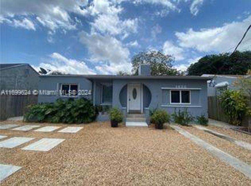 4 bedroom 4 bathroom home in desirable Allapattah location. Property has in law living quarters, lushly landscaped with private fenced yard. New roof, updated kitchens and baths. North exposure with fenced front yard / parking area. Also, great rental potential. Close to U Miami Health Center - 2 miles, downtown Miami 4 miles and easy access to I-95.