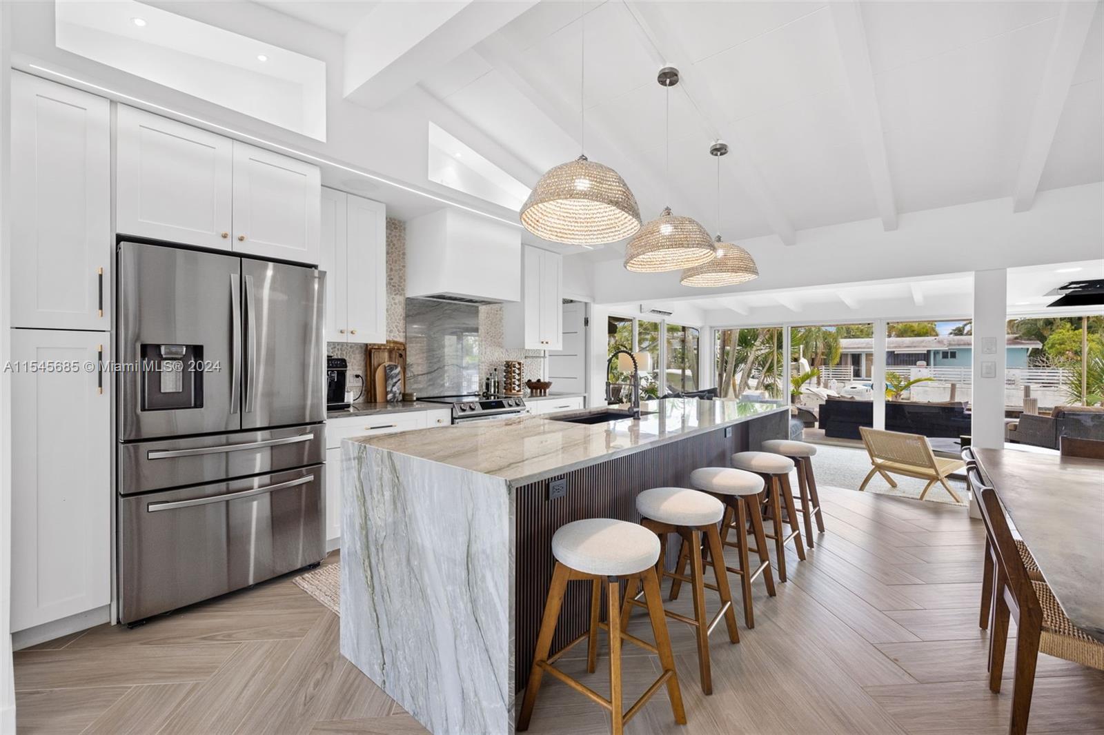 Step inside the serenity of this fully renovated waterfront oasis conveniently located in Lauderdale Isles! A captivating 3-bed, 2-bath waterfront residence spans 1,426sqft, seamlessly blending comfort and style. Double sliding impact windows open up a sunlit living area that flows effortlessly, revealing a modern kitchen adorned with top-notch appliances. Indulge in the luxury of spacious bedrooms and tastefully designed bathrooms. Enjoy the Waterfront lifestyle with 3 outdoor patios of living space and a private boat lift 12klb capacity & 40-foot dock. In a boater's paradise, this home offers easy access to Fort Lauderdale's stunning waterways, so schedule a viewing today and step into a world where elegance meets functionality. Welcome to the epitome of Fort Lauderdale living!