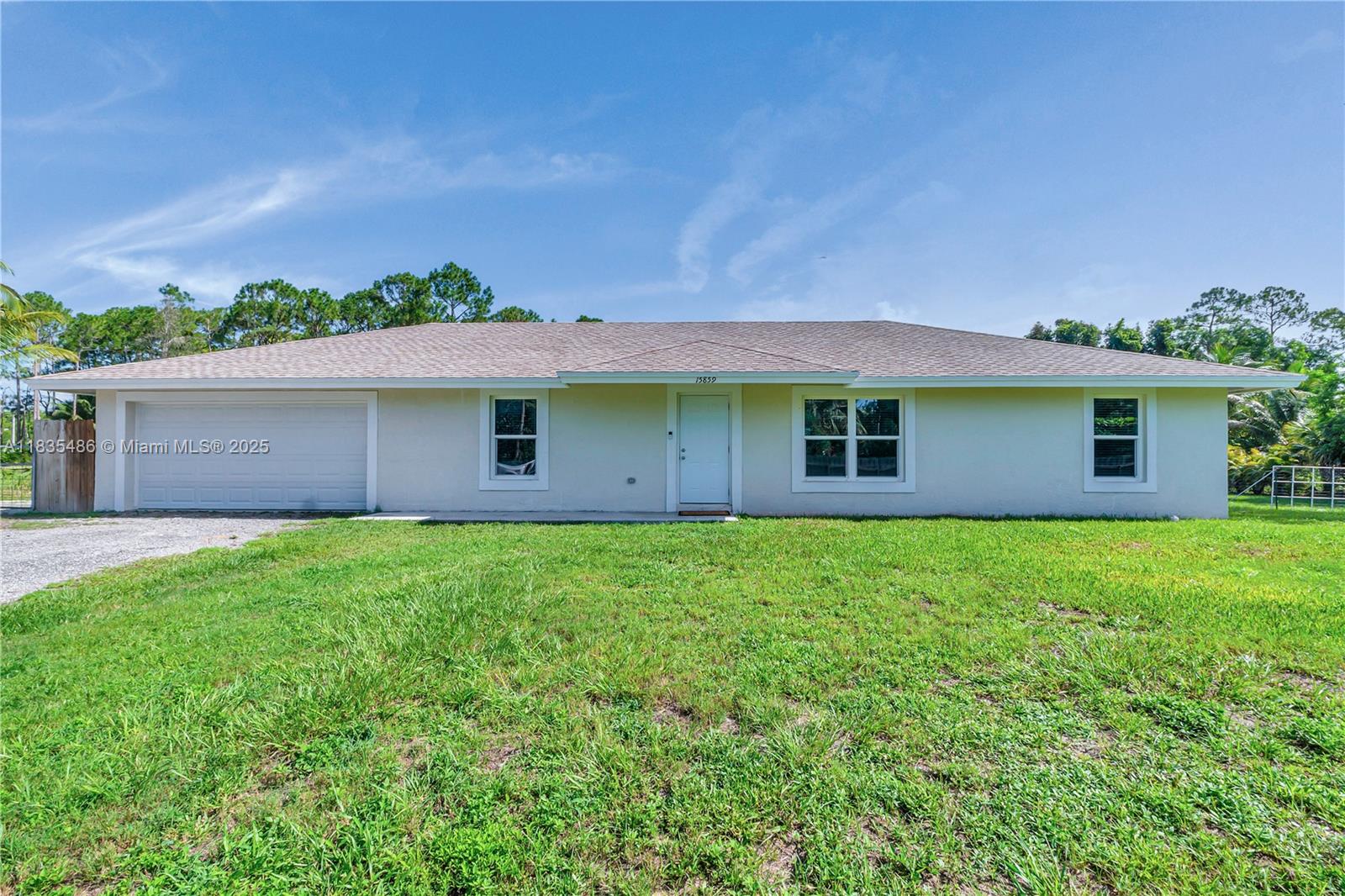 Turnkey 3BD/2BA + flex room/office in highly sought-after Loxahatchee—NO HOA! Built in 2015 and set on 1.14 fully fenced acres with an electric gate, this property is perfect for boaters, RV owners, or anyone craving space and freedom. Inside, enjoy 48” wood-grain porcelain tile, a freshly painted interior, white shaker cabinets, granite counters, Whirlpool appliances, and a brand-new AC with EcoBee smart thermostat. Impact windows/doors offer security and peace of mind. The versatile flex space is ideal for a home office or gym. Bathrooms are crisp and clean, and the 2-car garage provides ample storage. Roof is just 10 years old. Move-in ready and built for both comfort and lifestyle—this one won't last!
