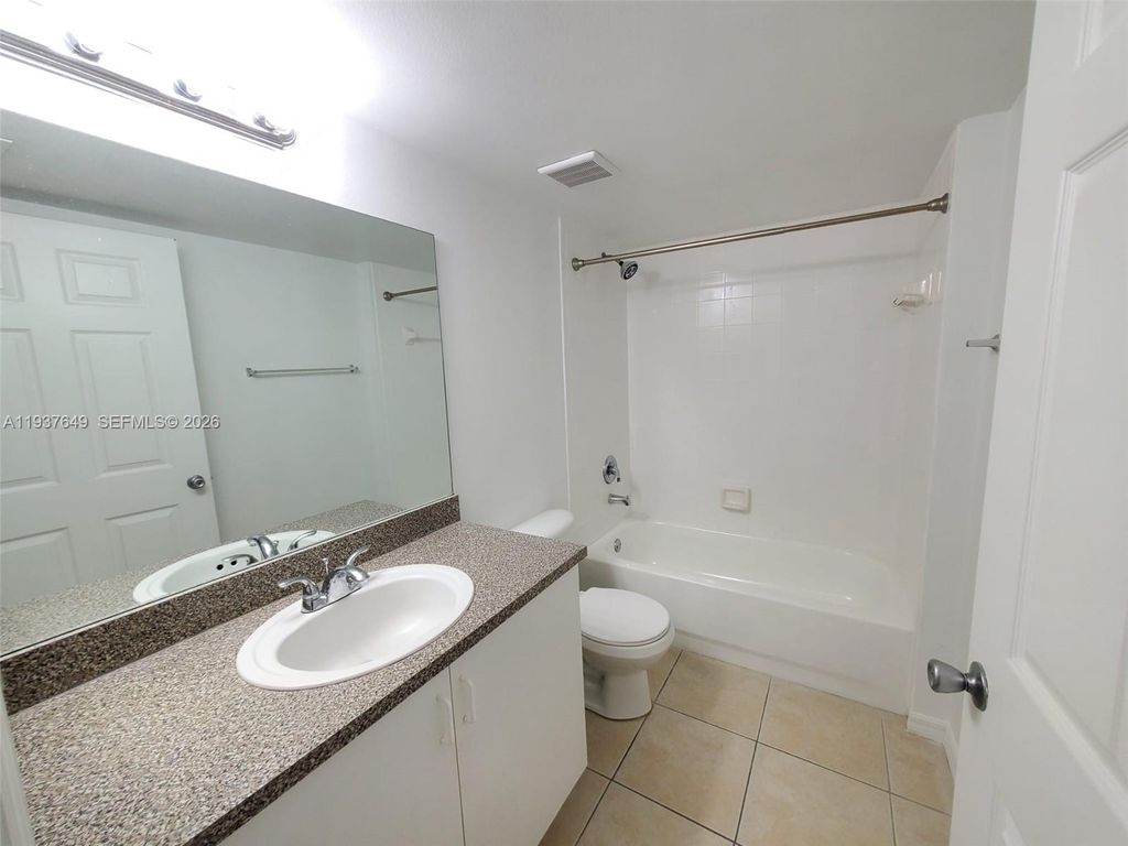 Photo of 5041 Wiles Rd #106, Coconut Creek, FL 33073 (MLS # A11937649)