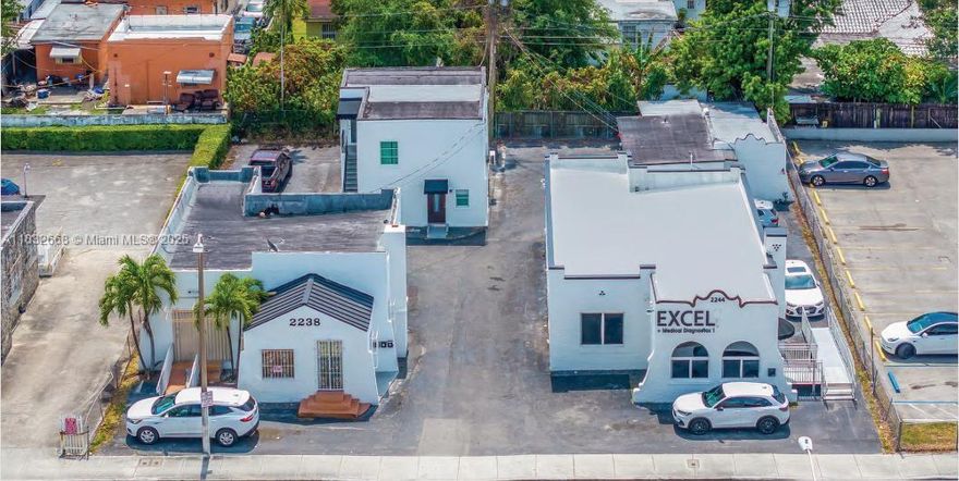 Income-generating mixed-use investment of two contiguous parcels in Zone T6-8-0. Although listed separately (folios 01-4103-029-0080 & 01-4103-029-0070), both will be conveyed as a single package. Parcel .0080 includes a fully leased office building generating $8,240/month, one-bedroom apartment ($2,000/month) and studio ($1,100/month). Parcel .0070 features a 3-bed/1-bath house ($2,500/month), a studio ($1,250/month) and two one-bedroom apartments ($2,000/month each). Combined monthly income totals $19,090. Zoning T6-8-0 permits mixed-use development and future redevelopment potential. High-demand location near retail, transit and major thoroughfares supports immediate cash flow and long-term appreciation. Contact the listing agent for full financials and showing instructions.