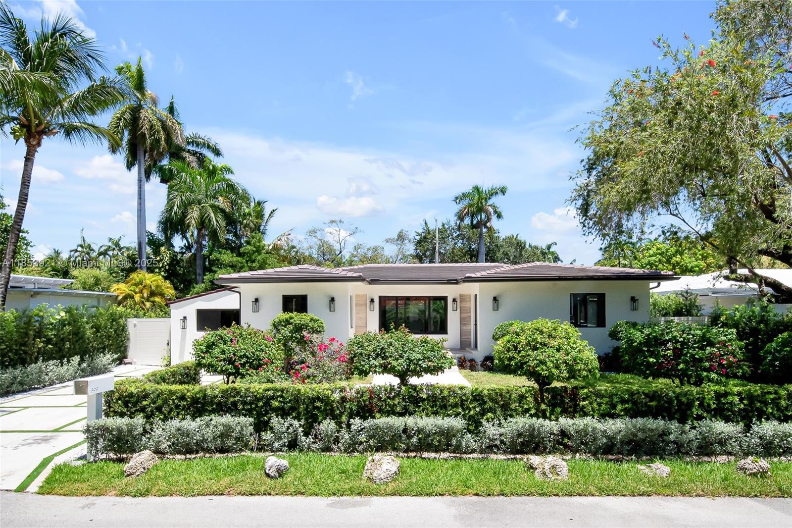 Stunningly renovated 4-bedroom, 3.5-bathroom Pool House nestled in the coveted Bayside Historic District. It blends timeless architecture with sleek, modern finishes, all just minutes from Miami’s most vibrant neighborhoods.
Open-concept living spaces, soaring ceilings, and seamless indoor-outdoor flow. The chef’s kitchen is outfitted with custom dark wood cabinetry, luxury stone countertops, and brand new appliances, including a gas stove. Floor-to-ceiling sliding doors lead to a tropical private oasis featuring a brand-new pool, lush landscaping, and elegant palm-lined privacy. Every bathroom has natural stone. The primary suite features a walk-in closet with custom-lit built-ins, providing both storage and style. Outdoor storage. Elevated House with new roof and impact windows. A Gem!