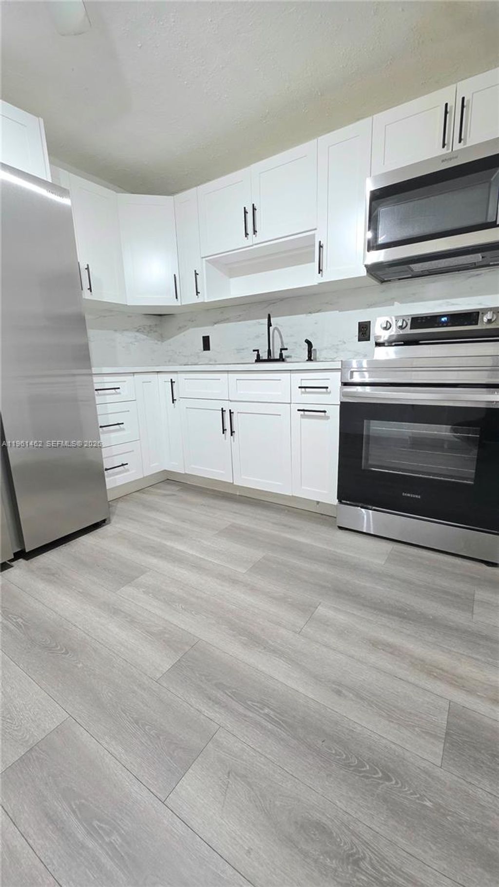 Photo of 6616 Raleigh St #1, Hollywood, FL 33024 (MLS # A11961462)