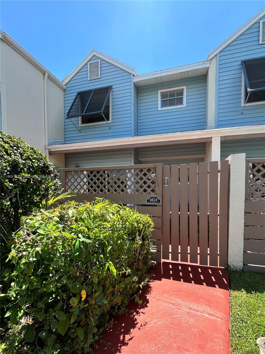 A rare find in Coconut Key! This beautifully maintained 2 bedroom, 2.5 bath townhome offers premier living with one of the community’s largest, most private backyards overlooking a peaceful water view. The spacious dine-in kitchen opens to a front courtyard, perfect for outdoor meals, while the back patio opens to the expansive backyard for more outdoor living. A full-size washer & dryer are included. Upstairs, the newly rebuilt deck of the primary suite is ideal for relaxing and enjoying the serene surroundings. Enjoy a quiet retreat minutes from top shopping and dining. Coconut Key residents enjoy resort-style amenities without high HOA fees, including a pool, sauna, tennis courts, indoor handball court, and fitness center. Schedule your private showing today and step into your new home.
