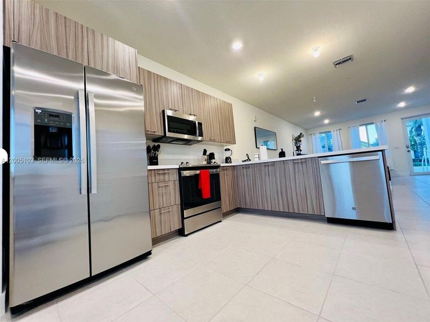 Welcome to a modern oasis at in vibrant Doral, FL. This stunning 3-bedroom, 2.5-bathroom townhouse spans 1,322 sq. ft., blending comfort and style. Inside, discover a spacious layout with natural light-filled living areas. The sleek kitchen suits culinary enthusiasts, while open-concept living and dining areas invite relaxation. The primary suite offers a serene retreat with an ensuite bath. Two additional bedrooms provide flexibility for guests or a home office. Year-round comfort is ensured with air conditioning. Enjoy tranquil lake views and community amenities like a state-of-the-art gym. Easy parking. This home embodies modern living in a prime location and newly upgraded laminate wood on 2nd floor.
