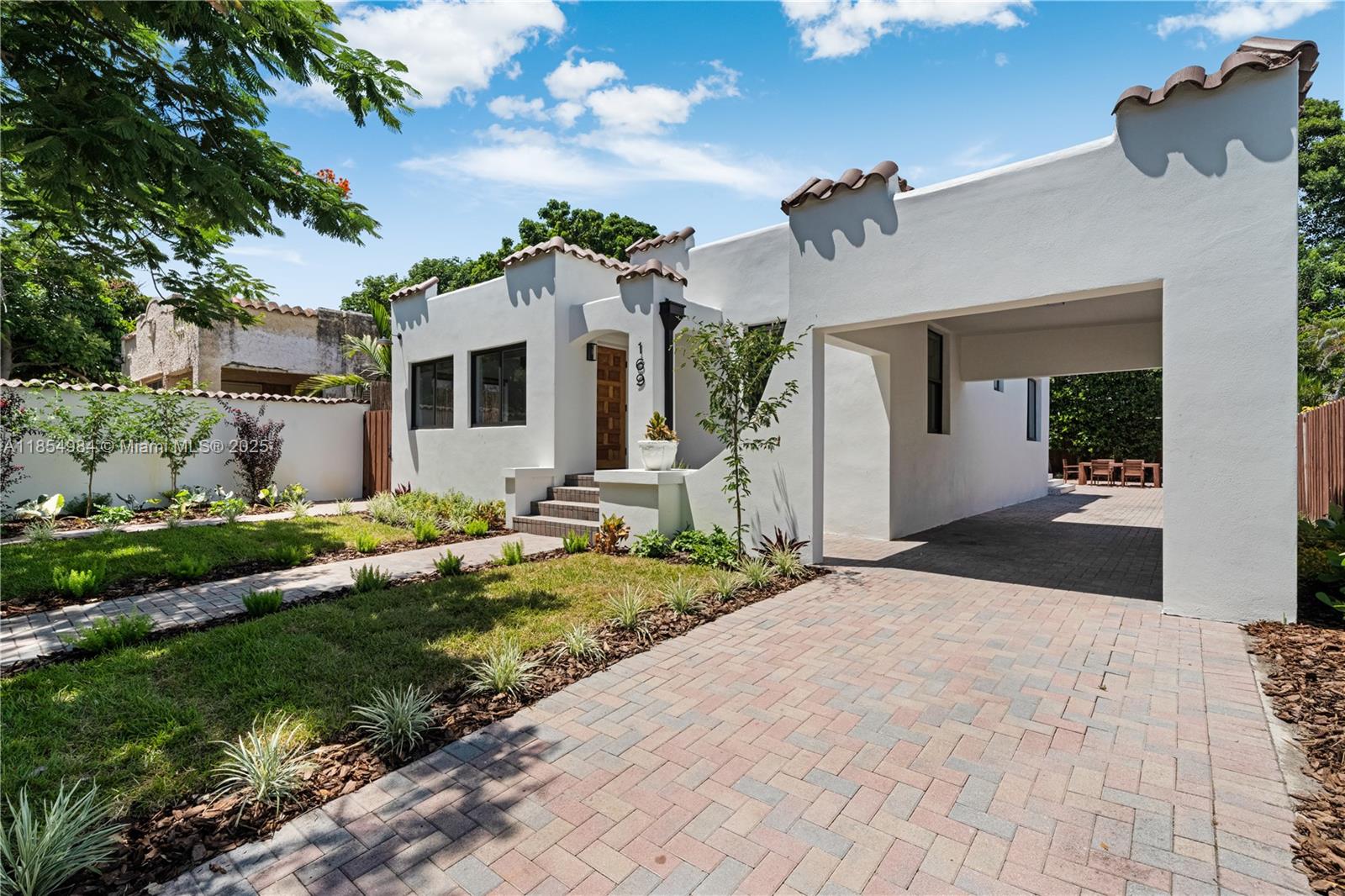 This is the one. walking distance to Design District and Ready to move in. Mission style architecture. fenced, manicured landscape, sprinklers. Impact glass windows, 3 bedrooms 2 bathrooms with lot of outside space .Carport. bright and cheerful. Beautiful wood like tile floors, warm colors. Open kitchen with marble backsplash and Stainless steel appliances , natural gas .Tankless water heather, Two bedrooms sharing one bathroom with shower , Oversized Master suite with large marble shower . California Closets. in every bedroom. Large backyard area, with pergola. Room for a pool. working fireplace. !!LOCATED in Buena Vista East Historic District (from NE 42nd Street to NE 48th St.). Please check Unbranded Matterport and video.