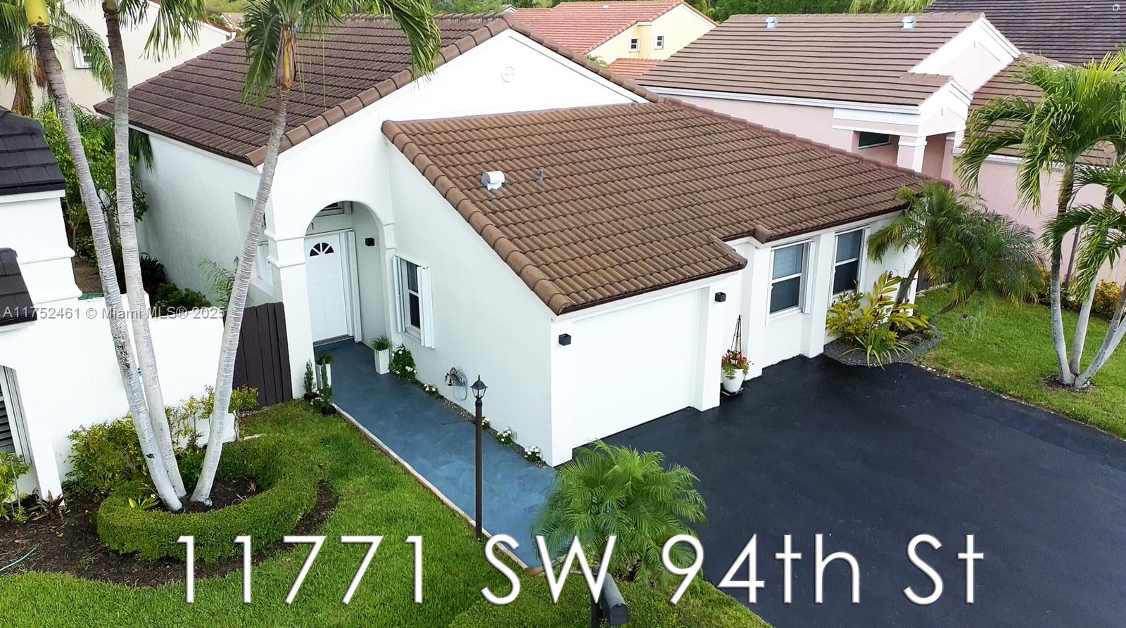 A MASTERPIECE REIMAGINED! Every inch of this fully renovated 4-bed, 2-bath home in the gated Poinciana at Kendall has been transformed. Soaring ceilings, sleek porcelain floors and a modern chef’s kitchen with new appliances set the stage. Both bathrooms are luxuriously remodeled, New AC, New water heater, while a New roof (2019) adds peace of mind. There is also a New garage door. The New backyard patio enhance outdoor living with New Retractable screen. There is a spacious driveway and newly added visitor parking is just steps away. Nestled near Miami Dade College and the Turnpike, with low HOA and a welcoming community, this home is the perfect blend of luxury and convenience. Don’t miss out—schedule your showing today!