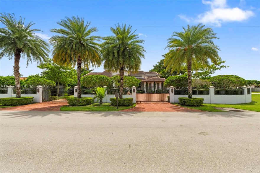 Stunning two-story estate in Miami on nearly an acre, featuring a European-style main house and a modern guest house. It offers 6 BRs, 7 BAs over 6,400 sq ft of living space, with a total area exceeding 8,500 sq ft. The chef’s kitchen highlights custom wood cabinetry, built-in appliances, and granite countertops. The bright dining area overlooks lush gardens, while a game room leads to a remodeled modern pool and outdoor entertaining area. The main living room has a vaulted ceiling with ambient lighting. The detached guest house features its own kitchen, private balcony, and entrance, making it an ideal accommodation for families or visitors. With mature landscaping, ample driveway space, and privacy, this turnkey property offers luxury and versatility, equipped with a generator. Must see!