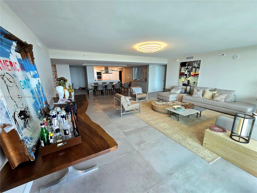 This impeccably furnished and decorated unit in Sunny Isles offers jaw-dropping waterfront views and is just steps from the beach. This residence includes 4 bedrooms, 4.5 bathrooms, a spacious family room, and a large terrace with incredible views. The unit features an open floor plan, porcelain tile flooring, floor-to-ceiling impact glass windows, a gourmet kitchen with quartz countertops, an induction stove, Wolf appliances, Italian cabinetry, electric blinds, and Ornare closets.

Premium amenities: 24/7 front desk/valet, 5 pools, movie theater, spa, gym, kids club, game room, playground, social room, and beach club. Located near the beach, Aventura Mall, and Bal Harbor Shops, with access to top-rated schools.