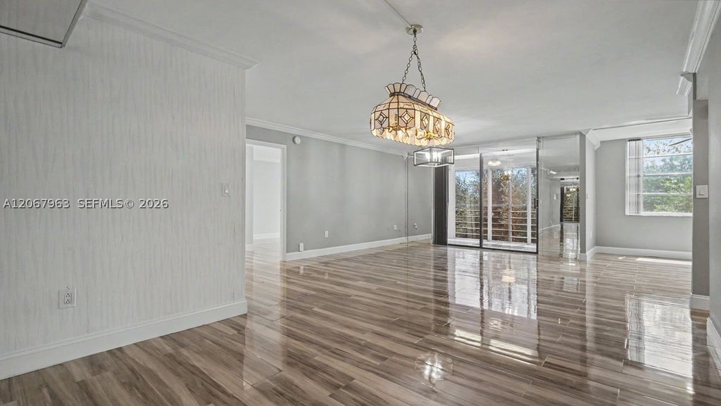 Photo of 1300 Saint Charles Pl #417, Pembroke Pines, FL 33026 (MLS # A12067963)
