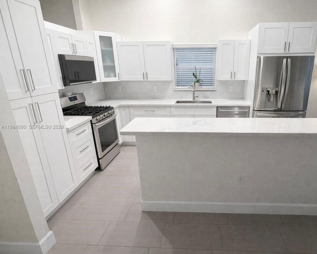 Photo of 1431 NW 129th Ave, Sunrise, FL 33323 (MLS # A11984090)