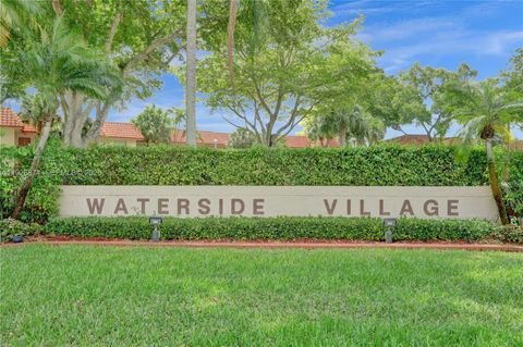 Photo of 15801 W Waterside Cir #101, Sunrise, FL 33326 (MLS # A11926874)