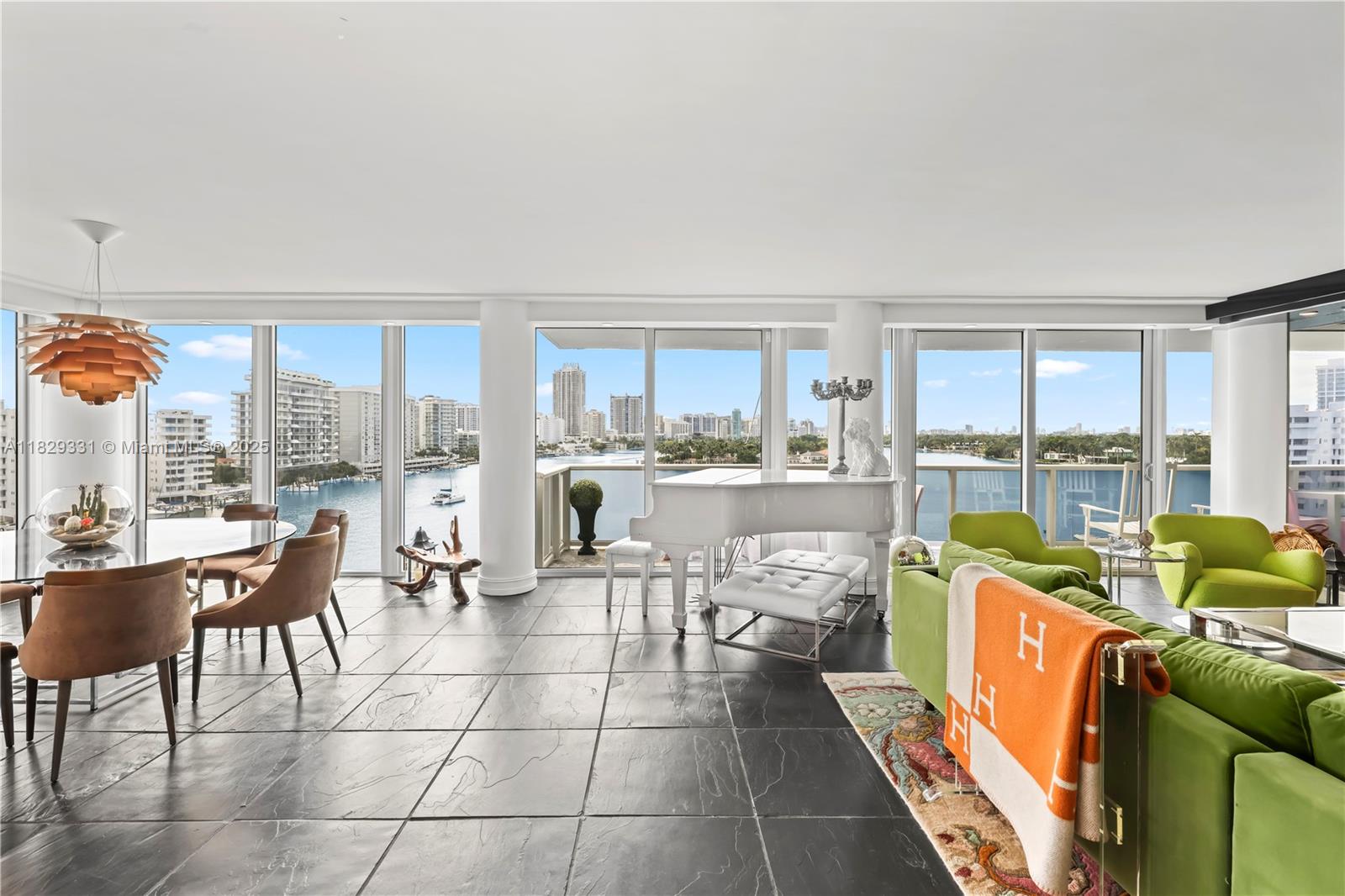 An entertainer & boater’s paradise! This rare corner 4-bed, 3-bath condo encompasses stunning views of the Ocean, Intracoastal, and Bay! Overlooking La Gorce & Allison Island, blending sophistication & elegance.. The inviting foyer opens to a custom kitchen with a spacious island and ample storage. Enjoy two balconies, including one that spans nearly 90 feet, ideal for soaking in breathtaking sunsets. The primary suite is a serene retreat with custom closets and direct water views. This luxurious home features heated floors, motorized shades, and a Kangen water system. Exceptional amenities include a 24/7 doorman, valet, an Olympic-sized heated pool, a gym, and a marina with a dock slip for boats up to 75 feet. An extraordinary lifestyle awaits in this unparalleled haven!