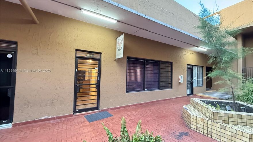 Prime location in Hialeah Commerce Plaza at West 37th St and 16th Ave. This warehouse/office/retail space unit features 1700 sq ft in ceramic tiles throughout first level and two bathrooms and a small kitchenet and cabinets. The property features two large spaces in the first floor that are perfect for office space, greet area and warehouse deposit. Also the property features a plus mezzanine of aprox 800 sq ft in the second floor, with access thru spiral steel stairs. The mezzanine has carpet floor entirely, showing a large office/meeting space and two private office spaces. This property has two brand new AC units installed June 2025, a third AC unit in perfect conditions and periodic maintenance. Roof was repaired one year ago. Two assigned parking spaces and multiple shared parking.