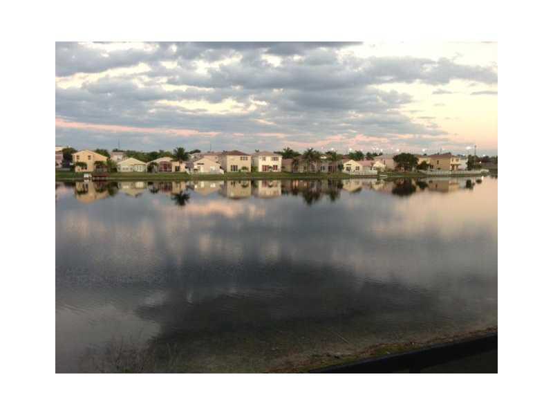 BEAUTIFUL ON OF A KIND 4 BEDROOM HOME ON THE MOST BEAUTIFUL LAKE IN THE AREA! VERY WELL KEPT, FAMILY ROOM, separate LIVING/DINING, BREAKFAST NOOK, NICE KITCHEN. TILE DOWNSTAIRS, CARPET UPSTAIRS, HUGE MASTER BEDROOM WITH BALCONY OVERLOOKING LAKE. ACCORDIAN SHUTTERS -ENJOY YOUR WEEKENDS IN YOUR SCREENED PATIO RELAXING IN THIS AMAZING LAKEFRONT HOME!