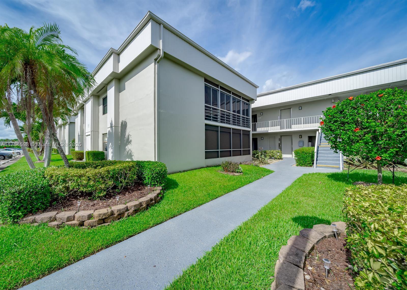 Experience the Florida lifestyle in the gated 55+ community of Kings Point, Delray Beach. Enjoy golf courses, pools, a theater, clubs, tennis courts, a cafe, and transportation. Located in the sought-after Isle of Capri, this 2nd-floor condo is close to the elevator and features CBS construction and covered walkways. Surrounded by golf courses, it offers 2 bedrooms: the primary has a large walk-in closet, a full bath with a walk-in shower, and access to a glassed-in balcony. The second bedroom includes a large window and a linear closet. The guest bath has a walk-in shower and a full-sized washer/dryer. Laminate floors are in the living areas and bedrooms, with tile in the kitchen and balcony. All windows are impact-resistant. EASY TO SHOW!