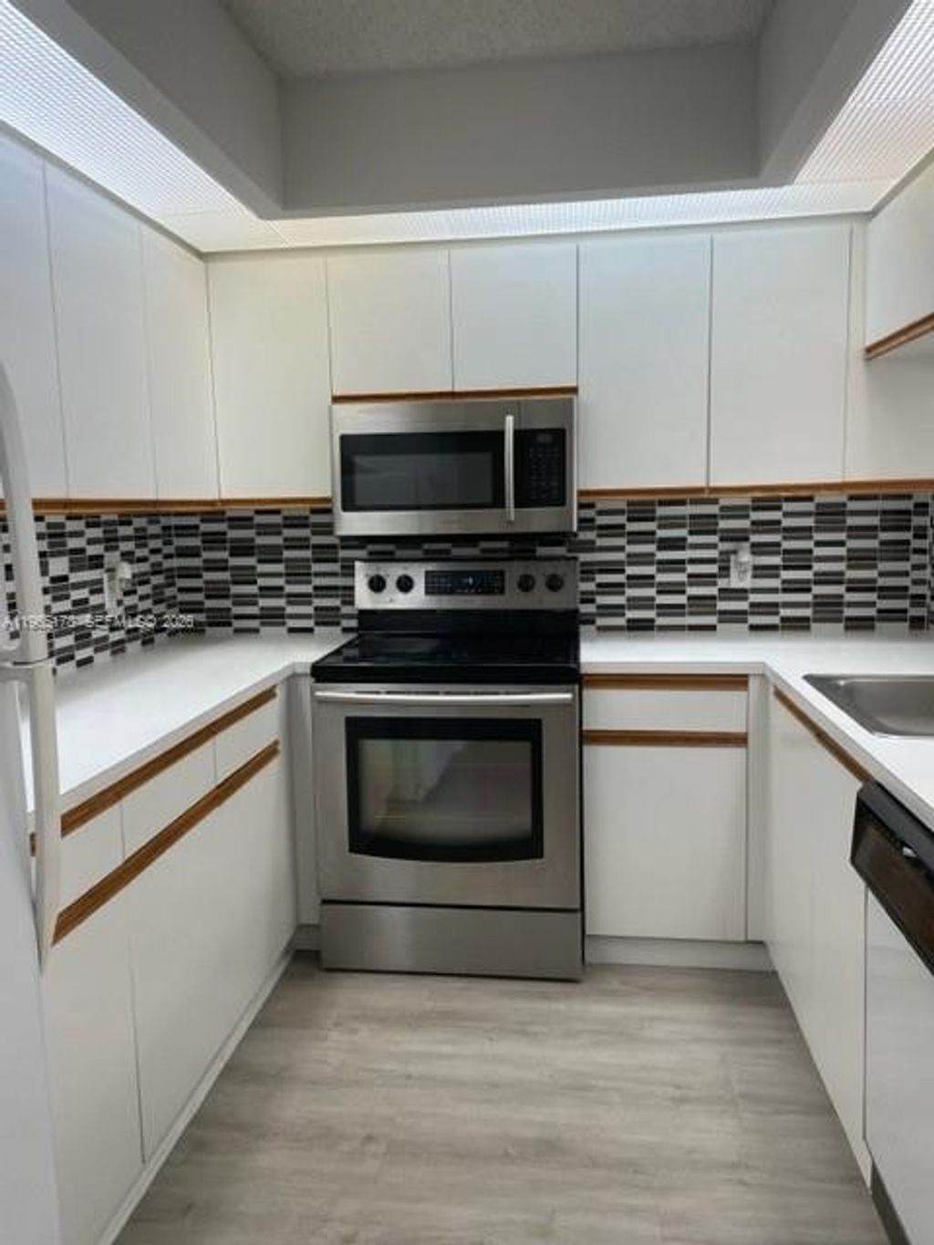 Photo of 1200 SW 125th Ave #303L, Pembroke Pines, FL 33027 (MLS # A11965178)