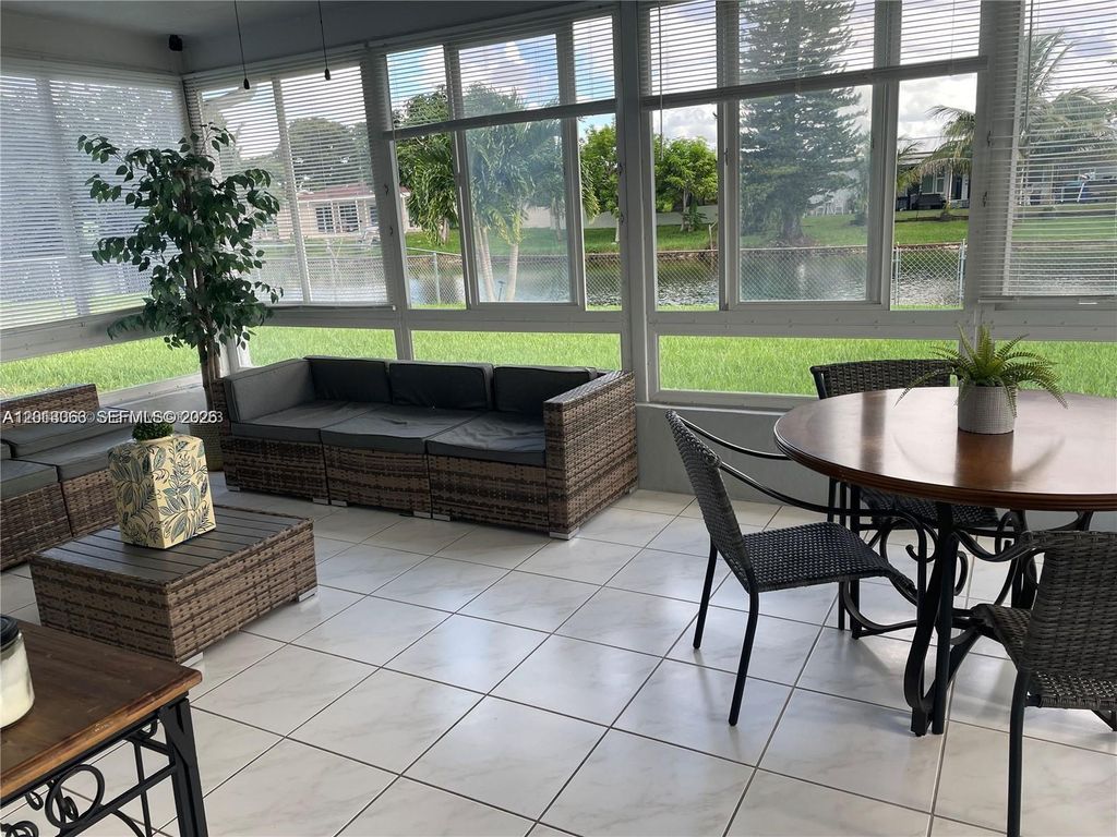 Photo of 9590 NW 24th Pl, Sunrise, FL 33322 (MLS # A12013363)
