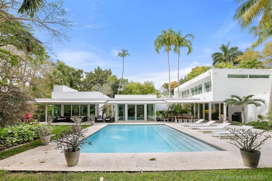 The architectural masterpiece is part of the exclusive Snapper Creek Lakes Club, a private community in S. Coral Gables, one of Miami's top luxury neighborhoods. Amenities include access to a private marina w/24 hr dock-master and use of the clubhouse. A perfect testament of the Tropical Modern Design the 5/5.5 wonder features expansive windows and sliding doors all around, promoting a seamless flow form indoors to outdoors, w/beautiful views of lush garden originally designed by Raymond Jungles. The living room boasts 12 feet high ceiling and fireplace, family room is an oasis on its own, gourmet kitchen is a dream come true for the most deserting chef. A separate 2 story guest house offers full kitchen/dining/living. 1 bedroom dwn/strs and spacious master on 2nd flr. State of art garage.