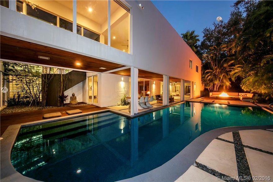 This magnificent 2-stry modern home rests on a 37,157 SF lot in the much-desired Ponce-Davis area. +/-8,101 SF of open living spaces, formal living & dining room w/24ft ceilings, amazing Art walls perfect for Collector, fine Lava stone floors & 1000 btl wine room. Arclinea Chef’s kitchen, stunning master suite & spa style bath, 2nd floor family/media rm. Amazing grounds & landscaping, over 400 palms, outdoor built-in seating & pool w/fire pit. Great opportunity to live in Miami’s best neighborhood.