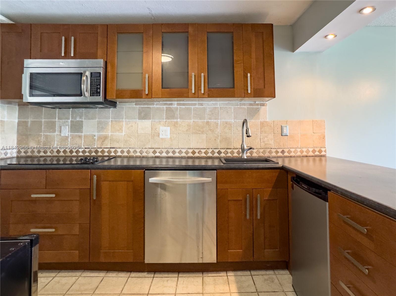 Welcome to this beautifully upgraded 2-bedroom, 2-bathroom condo located on the second floor of a well-maintained building in a vibrant 55+ community in Inverrary/Lauderhill. This bright and spacious unit features modern finishes, an open living/dining area, and a private screened balcony perfect for enjoying your morning coffee or evening breeze.
The updated kitchen offers contemporary cabinetry, and quality appliances including a wine cooler, mini fridge, dishwasher, cooktop, and microwave.
Generously sized bedrooms provide ample storage with walk-in closets and natural light.
This guard gated community offers convenient laundry facilities on each floor and resort style amenities such as gym, pool, clubhouse, library and much more.