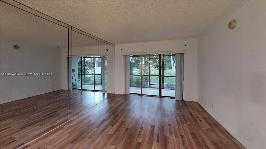 Be a part of this peaceful, small community of Raintree. This is a 2 bedroom and 1.5 bath. The patio has been completely renovated with new travertine tiles, new screen mesh, and thick glass windows at the bottom frames to prevent critters from trespassing. Every room and ceilings have been freshly painted and new laminate flooring installed. Enjoy the ease of modern, stainless steel appliances including high-end dependable LG washer/dryer, iSamsung French refrigerator and Sharp microwave oven for your convenience. Kitchen boasts lots of cabinets with new sink and has a window view that showcases the beautiful, well-maintained community pool. Both bathrooms have new mirrors and guest bath has new toilet bowl with a high-tech flushing system.