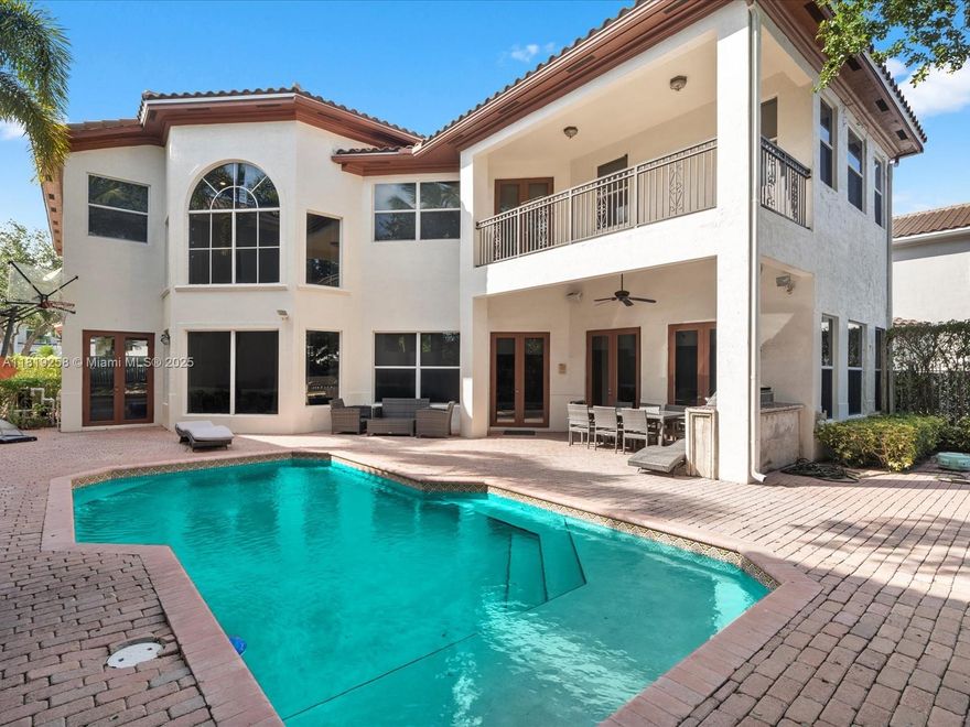 Exquisite oversized Brookman-Fels home in the gated Presidential Estates, ideally situated in one of the best locations facing a serene lake and within walking distance to the new amenities clubhouse. This custom 4,780 sq ft gem on Ambassador Court sits on a 9,500 sq ft lot. Enter through a grand foyer with soaring ceilings into a stunning open floor plan. The 5-bedroom, 5.5-bathroom home boasts spacious rooms, a gourmet chef’s kitchen with premium appliances, a dedicated office, and a full-service quarter. Enjoy tranquil lake views from the primary suite’s balcony. The lush backyard oasis features a custom pool, a summer kitchen, open and covered patios, and ample guest space. The garage offers extra storage or the potential to convert into additional space, such as a gym or game room.