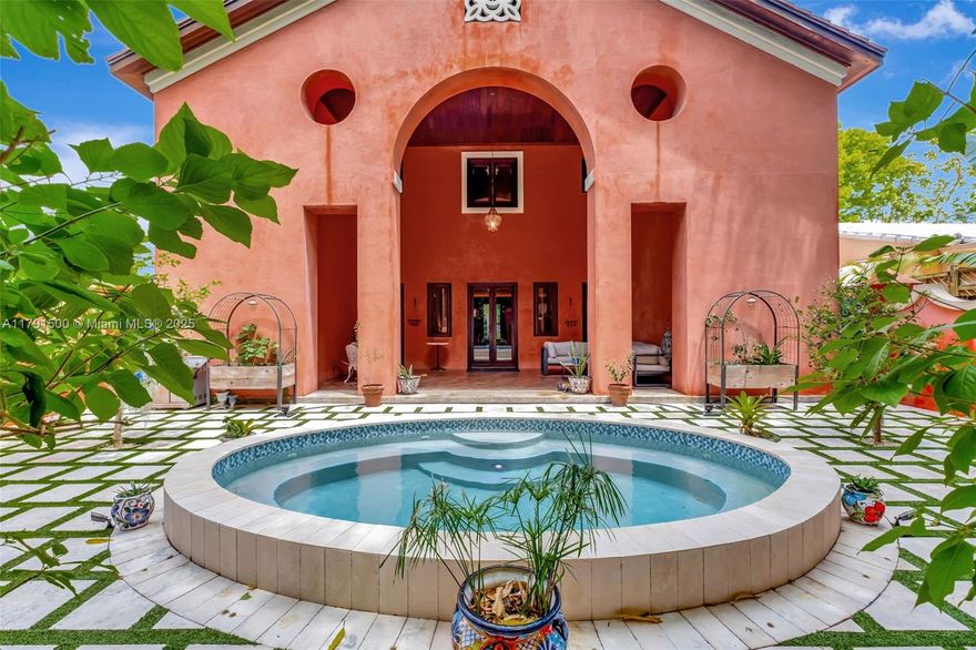 Ca’Rosa is a 4BD (+1 extra room)/3BA Venetian-inspired villa on a high elevation lot in verdant North Coconut Grove. Designed by Trelles Cabarrocas Architects, this magazine-worthy home won the 2013 Mizner Award for Excellence in Architecture. A perfect home to entertain in, Ca’Rosa features 12’ ceilings, combination pool/hot tub, soaring covered loggia, hand-blown Murano glass light fixtures, polished concrete floors, yellow pine paneling, and lush gardens with fruit trees and Florida native plants. Chef’s kitchen includes Wolf range, Bosch refrigerator, Miele dishwasher, marble counters and handmade mahogany/stained glass cabinetry. 11KW owned solar and smart thermostats can cover nearly all electricity costs. EV charger, huge attic, storage room, and generous closets. A masterpiece.