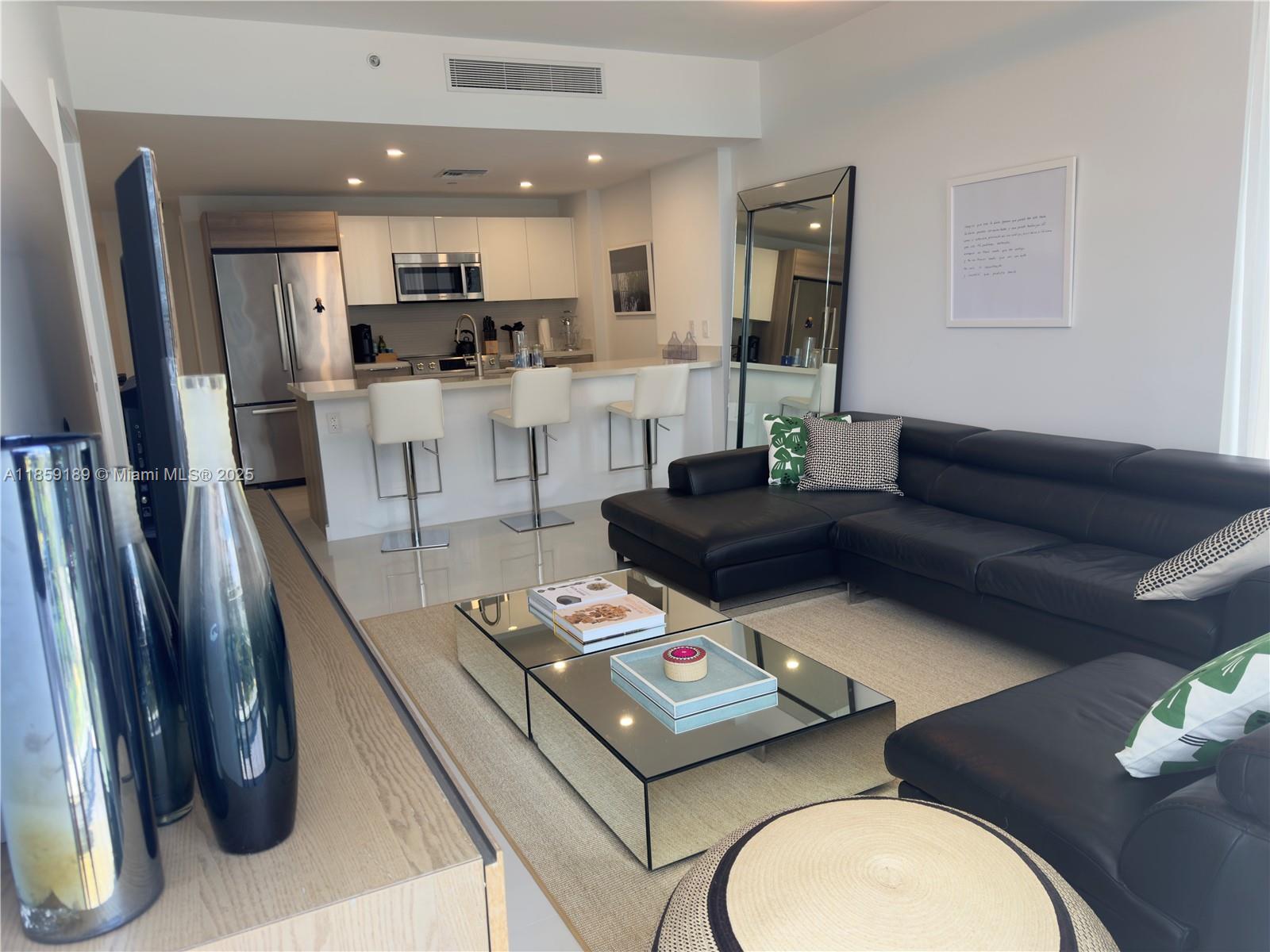 Enjoy the best of Bay Harbor Islands with this desirable and spacious unit, unit offers two assigned covered parking spaces and access to all the upscale amenities of a luxury building. Whether you're relaxing by the pool, working out in the modern fitness center, or entertaining guests, this residence offers comfort, convenience, and elegance. The unit offers a large balcony overlooking the city. Unit comes fully furnished. Roof amenities with infinity edge pool, Barbecue Grill and More..come and enjoy the best sunsets of the island. Other amenities 24 hours front desk, spacious Gym, boat docks, media room and more..