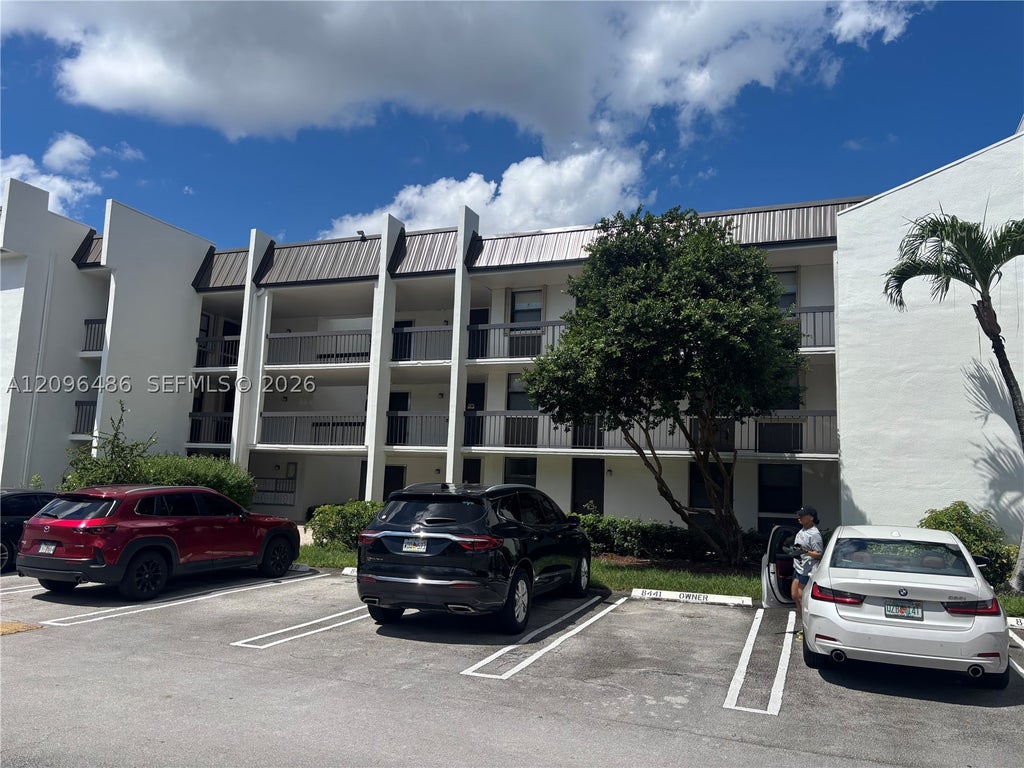 Photo of 8441 Forest Hills Dr #203, Coral Springs, FL 33065 (MLS # A12096486)