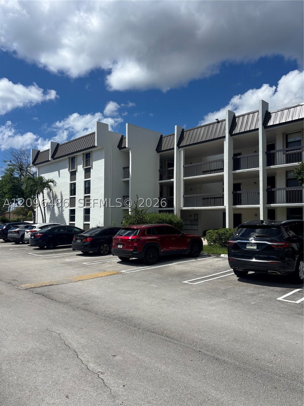 Photo of 8441 Forest Hills Dr #203, Coral Springs, FL 33065 (MLS # A12096486)