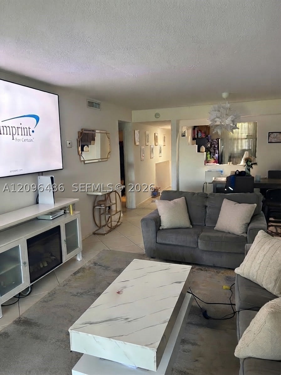 Photo of 8441 Forest Hills Dr #203, Coral Springs, FL 33065 (MLS # A12096486)