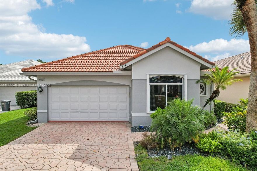 Step into luxury with this updated 3/2.5 gem located in the prestigious Hammock Point community. This residence boasts an open floor plan with high ceiling, laminate flooring throughout, a white kitchen with sleek quartz countertops with plenty of seating and shaker cabinets as well as remodeled modern bathrooms. Recent upgrades including a 2019 barrel tile roof, 2020 A/C, 2022 water heater, freshly painted interior & exterior, accordion shutters, impact front door and newer appliances. This gated community of 20 homes offers a low maintenance fee which covers landscaping, exterior painting, & roof cleaning. Located across from Boca Lago Country Club which offers optional memberships for golf, swimming, and tennis, you can enjoy a top-notch facility right at your doorstep.