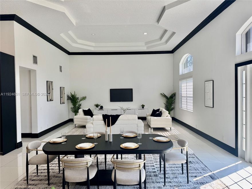 Just staged, new professional interior photos coming soon! Brand New Roof 2026. Set within the gated enclave of Emerald Springs Estates, this modern elegance is on the community’s largest lot with 1.5 acres of beautifully designed grounds, complete with a private sports court and resort-style outdoor living. Fully remodeled in 2021, the home offers 4 bedrooms and 4 bathrooms, each updated with new showers, designer fixtures, custom closets, and sleek white porcelain flooring that carries throughout the residence. The primary suite is a true retreat, with an oversized room highlighted by a Chanel-influenced walk-in closet with luxury designer flooring. The kitchen is equally impressive, reimagined with top-tier finishes and a complete collection of Fulgor Milano Italian appliances, including two refrigerators, a wine fridge, double oven, drawer microwave, built-in espresso machine, an island beverage fridge, and a Bosch dishwasher. Three A/C units, a new water heater, new washer and dryer, and accordion shutters offer comfort and peace of mind. The pool and spa were fully renovated in 2021. Expansive outdoor space and room to personalize with an outdoor kitchen or additional amenities, this rare Davie estate blends luxury, privacy, and scale in a way few homes can match.