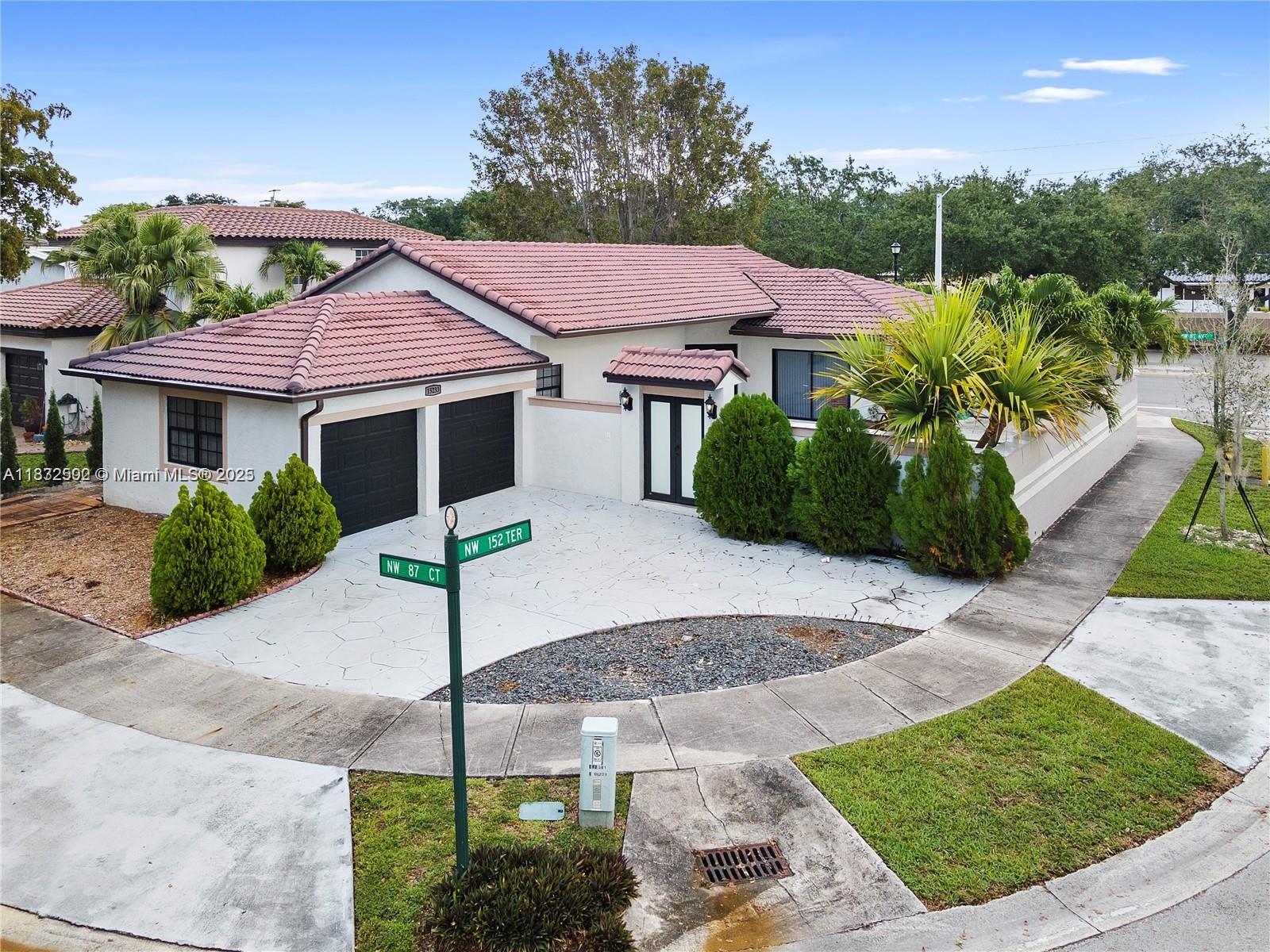 Beautiful home in a sought-after prime location of Miami Lakes. Located in an interior corner lot, on a cul-de-sac. Close to schools & shopping centers & very accessible to I75 & Palmetto. Home is a well-kept 1 floor 3-bedroom 2bathroom with a 2-car garage. Pulling up your greeted with a circular driveway for plenty of parking. This home has a gorgeous entrance to a walled & fenced private courtyard Perfect for entertaining & family events. As you enter through the double doors you have vaulted ceilings for your living dining area. Master bedroom sits to your right separate from the other 2 bedrooms. Walking to your left you have a very cozy family room/kitchen combo. Kitchen has granite counters, stainless appliances & convection oven. Bonuses are brand new HVAC & washer dryer included.
