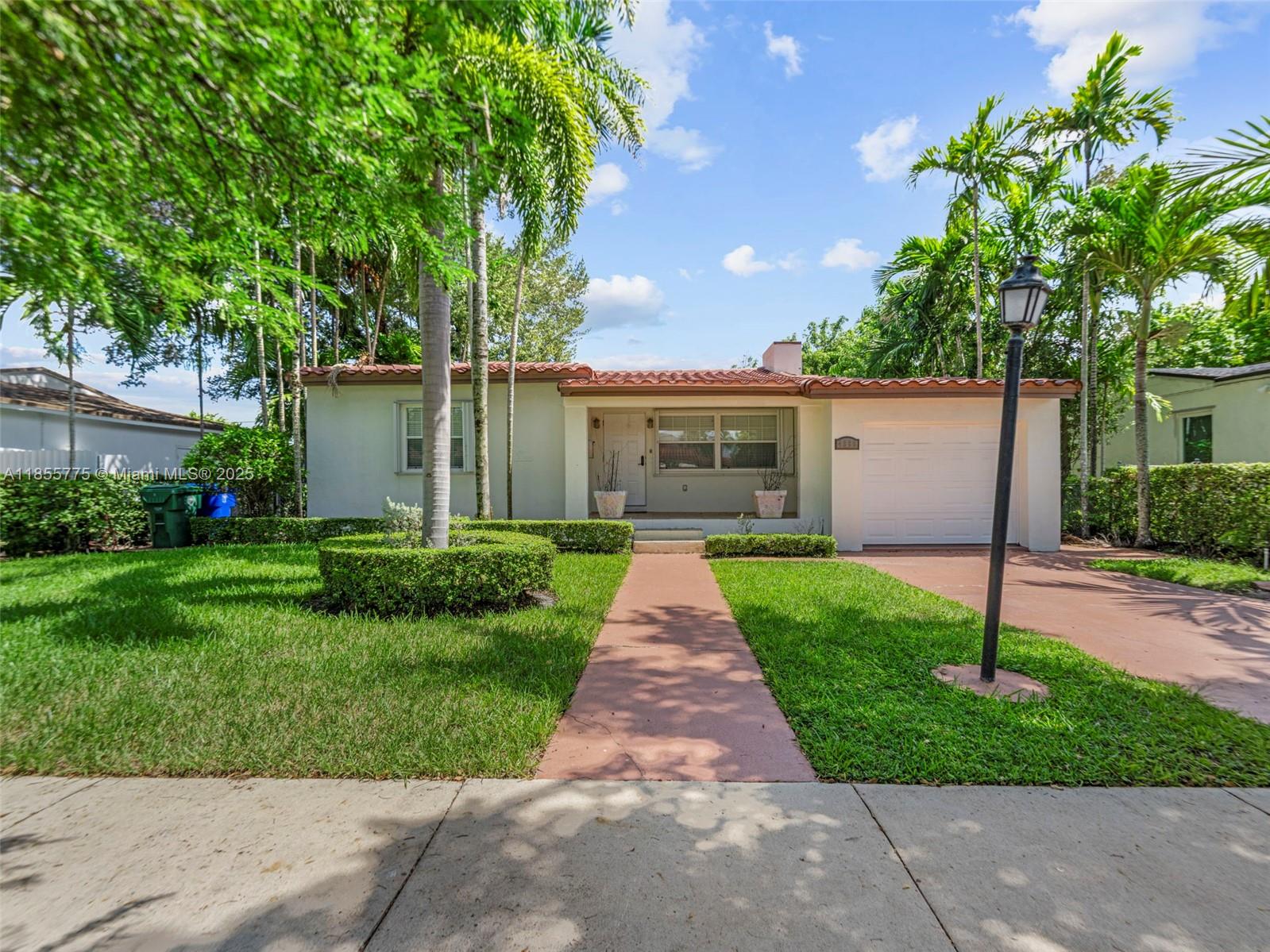 Move right into this bright and cozy home with an open layout perfect for entertaining. Enjoy a spacious kitchen featuring stainless steel appliances, ample counter space, and stylish pendant lighting. The large living area flows to a covered patio and lush backyard, ideal for relaxing or hosting friends. Features include a great room, a garage with laundry, and a storage shed. Prime location in Coral Gables, close to shops, dining, and major highways. Ready for your next chapter!