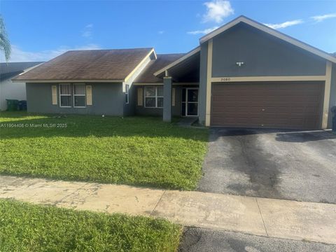 Photo of 7060 NW 47th Pl, Lauderhill, FL 33319 (MLS # A11904408) Photo of 7060 NW 47th Pl, Lauderhill, FL 33319 (MLS # A11904408)