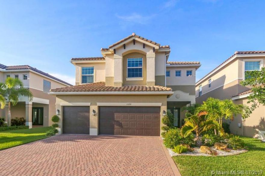 Immaculate Designer pool home located in the gated West Boynton community of Canyon Trails. 6 bedrooms, 5 bathrooms, plus loft on a larger premium lakefront lot with unobstructed view. Almost $200,000 in upgrades have been completed. Impact Windows throughout. Gypcrete subfloor on second level. Kitchen features all stainless steel appliances with double oven, hood vent, and wine chiller. Family room looks out over gorgeous lake view. 6th bedroom has been converted to office with custom built in desk and st