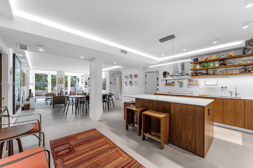 Stunning, fully remodeled 3BR/3BA end-unit in Floranda in Key Colony. Expanded to 1,864 SF under AC and 2,346 SF total, this home features a huge private terrace opening to the garden. Gut-renovated with impact windows/doors, redesigned layout, and premium Miele, Sub-Zero & Bosch appliances. Bright split floorplan with beautifully updated kitchen, baths and floors and great afternoon light. Quiet, private and move-in ready - steps to the beach, pools, tennis courts, Golden Hog, playground and more. 40-year cert complete; assessment fully paid.