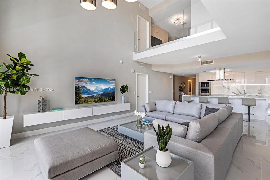 This luxurious two-story apartment is a modern marvel, flooded with natural light and offering unparalleled water views. Set within a brand-new, 5-star building, it redefines luxury living. 3,100SQFT 3 bed plus den 4 full bath, The open-concept layout seamlessly connects the living, dining, and kitchen areas, providing a spacious and welcoming environment. Three balconies expand the living space, offering serene spots to enjoy the stunning vistas.In addition to its remarkable features, this apartment includes a spacious laundry room for added convenience. Two master en-suite bathrooms offer privacy and comfort for every resident. The building itself boasts five pools, a private theater, a top-tier gym, and a beach club, ensuring a life of leisure and indulgence.