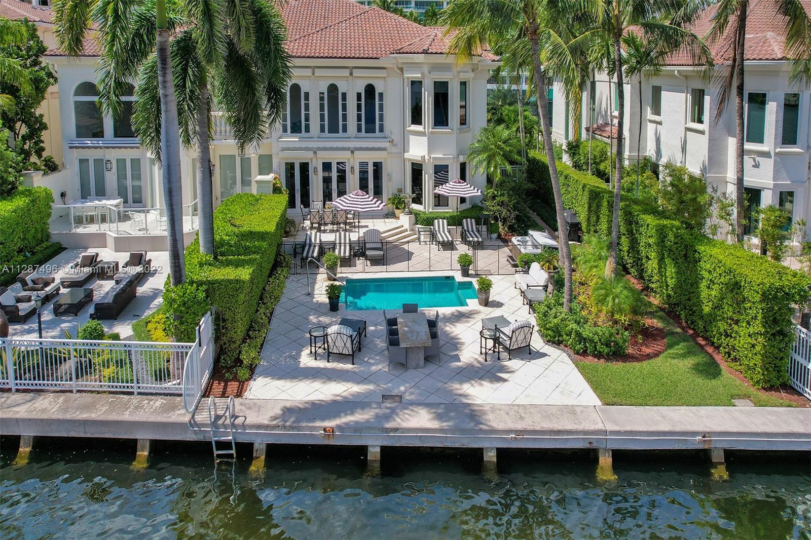 PORTO VITA Luxurious waterfront residence offering the ultimate setting for entertaining, both indoors & out. Directly on the Intracoastal Waterway with its own private pool. This 4-bedroom 5 bath home has a large outdoor space with seating areas for entertaining & spectacular waterfront views across the intracoastal to Golden Beach. 2 car garage with additional storage. Private elevator. Secure gated community with Spa, Restaurants, Tennis, and much more! Located on Prestigious Country Club Drive in the Heart of Aventura. 3.5-mile walking and bike path across from the property. Minutes to the Beach.