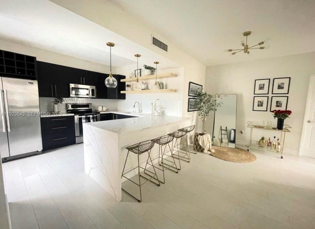 Photo of 11864 NW 11th St #11864, Pembroke Pines, FL 33026 (MLS # A11929543)