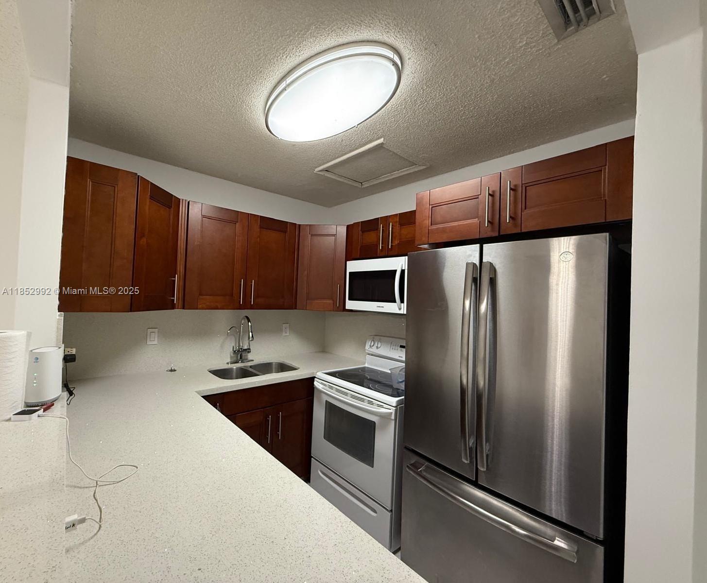 Spacious 3b/2b condo located in the Lago Grande gated community. Unit with titles floors, spacious bedrooms, balcony, washer & dryer. Located on the 2nd floor (no elevator). Community amenities including guard at gate, a pool, play area and many more. Parking by decal, 1 assigned parking plus guest parking. Pets allowed with landlord's approval. Located close to supermarkets, pharmacies, and restaurants. Call today for an appointment. Don't miss out!