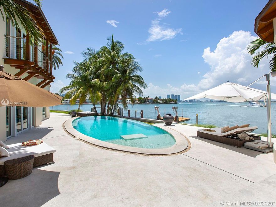 Located on highly sought after Venetian Islands with westerly sunset views, this modern Mediterranean-style estate offers a breathtaking sight of Miami’s iconic skyline. With over 210 FT of water frontage on the wide-open bay, you’ll be able to unwind from the restless Miami Beach life while still experiencing panoramic views from the comfort of your home. This 6 BD / 6.5 BA waterfront home comes with a large pool, a summer kitchen with built-in grill, and rolling lawns surrounded by Royal Palm trees with grand sweeping entrance. Marble and wood floors throughout the home, elevator, large master suite and adjoining office, with large relaxing terrace. Call today to take a tour of this home!