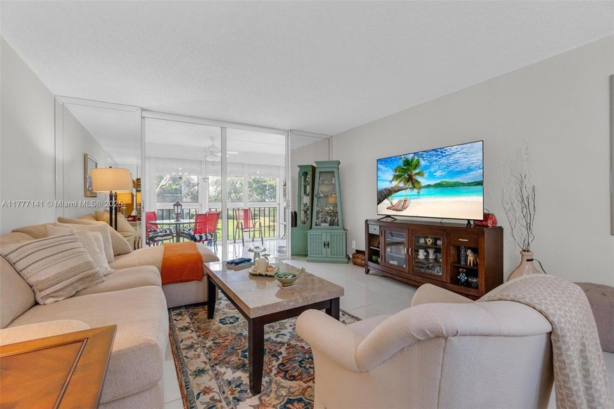 Must See Corner Unit with amazing views 2 Bed/ 2 Bath Condo with Stunning Water and garden views from the screened patio, living room and primary bedroom. Welcome to the coveted 55+ community of Deauville Village in West Delray Beach. This spacious and meticulously maintained condo is a beauty and has been upgraded with newer flooring, kitchen and bathroom updates. The HOA includes Water, Sewer, Trash, & Xfinity Cable TV. Brand-new State of the Art Clubhouse, Pool, Spa, Recreation facility and much more.